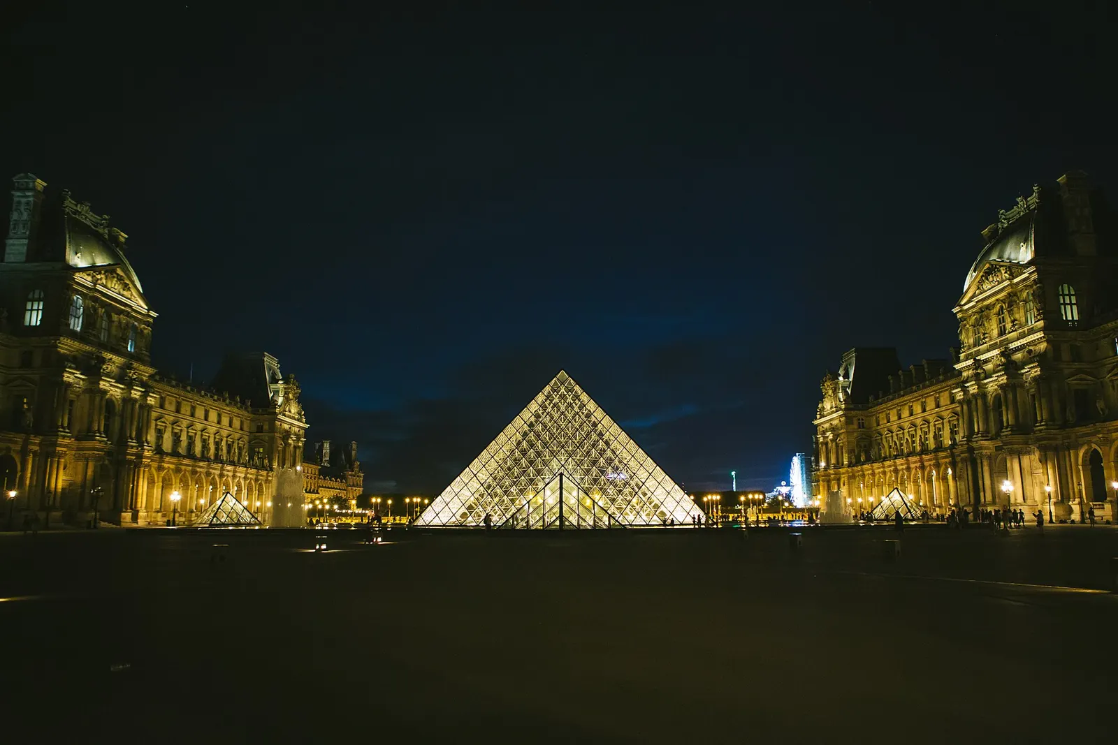 The Louvre pyramid at night. Louis Vuitton closed Paris Fashion Week outside the Louvre.